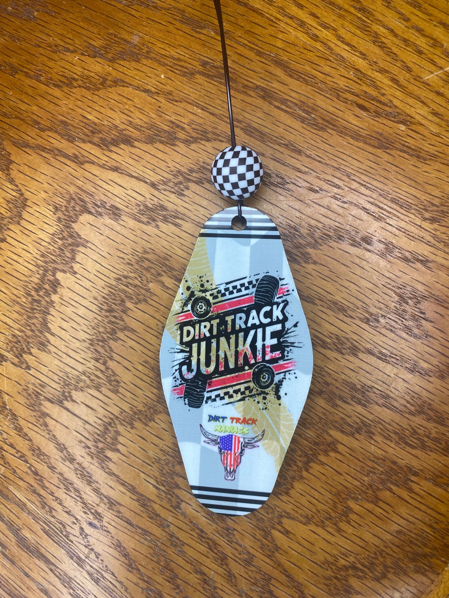 Rear View Mirror Dangler Featuring a Dirt Track Maniac Design