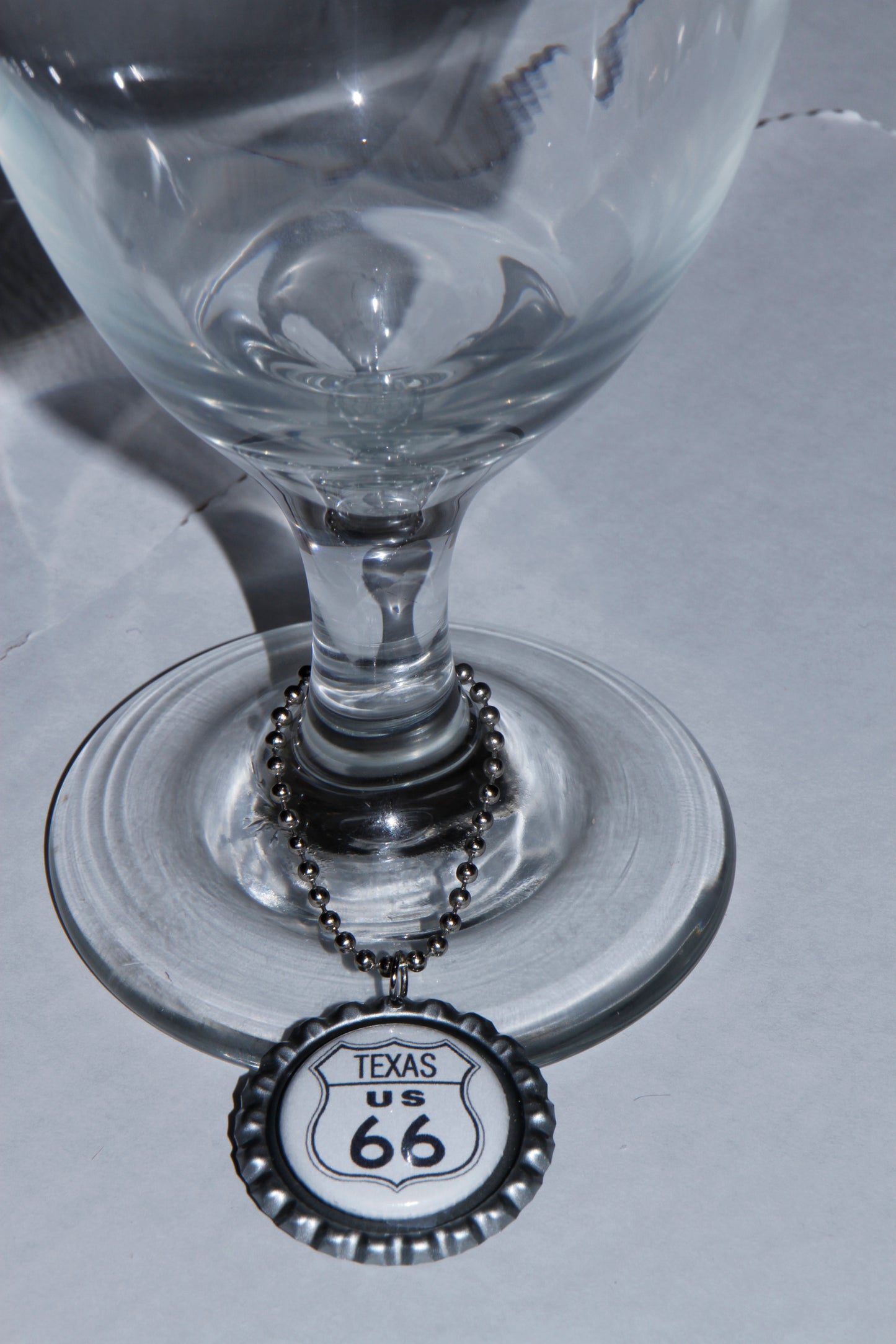 Route 66 Wine Glass Charms features one charm for each state on Route 66